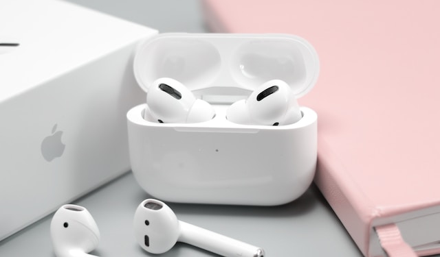white colored earbuds with case